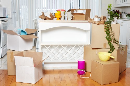 Movers carrying office furniture during a Botanybay commercial relocation