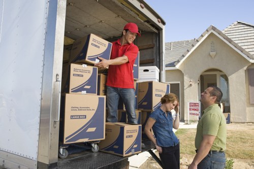 Careful loading of boxes and furniture into a moving van